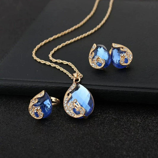 Parure Collier et Boucles d'oreilles Goutte Cristal Bleu en Or
