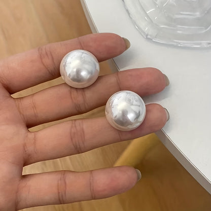 Les Boucles d'Oreilles Perle de Caractère