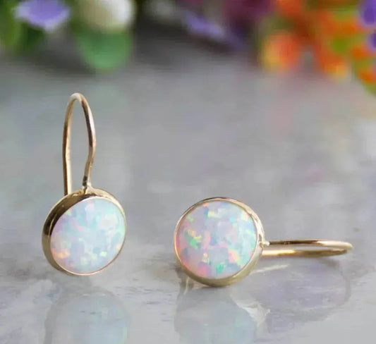 Boucles d'oreilles en or avec pierre opale vintage